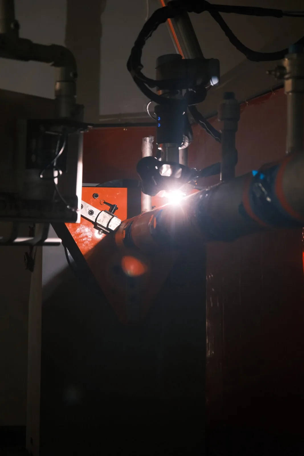 Close-up of the AutonoWeld M4 welding torch arc on a pipe spool