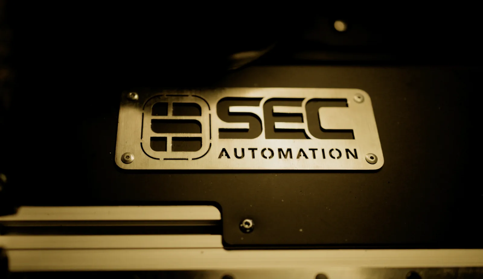 SEC Automation badge on the AutonoWeld M4 welding machine